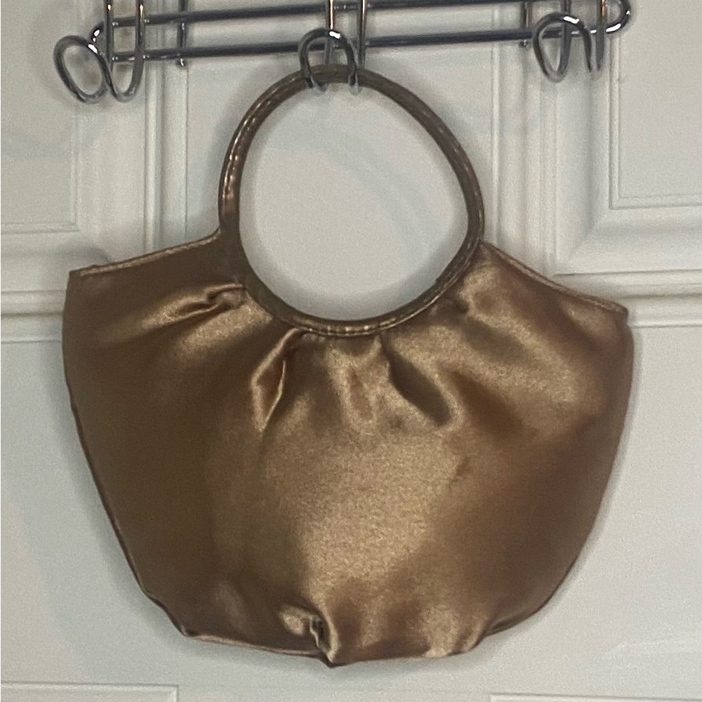 Small purse great for a night out. Or for a little girl.